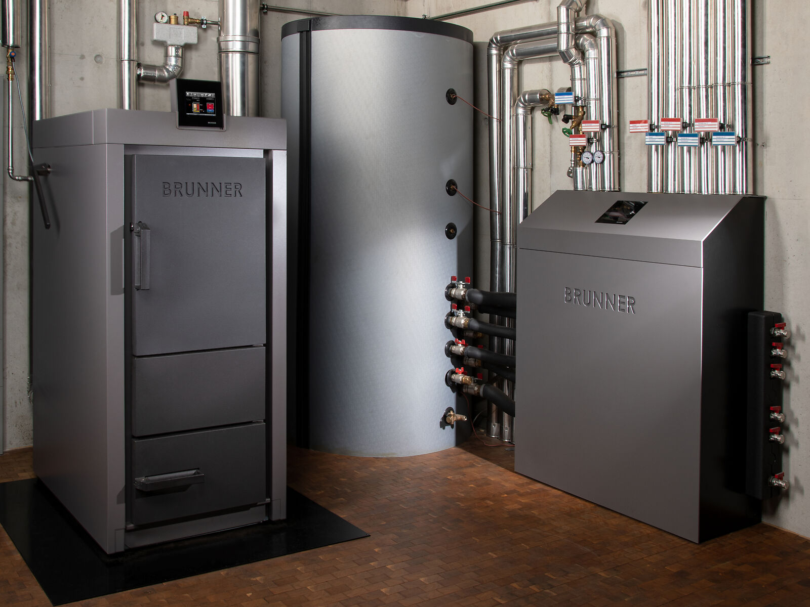 Boiler room with log wood heating system, heating center and buffer tank